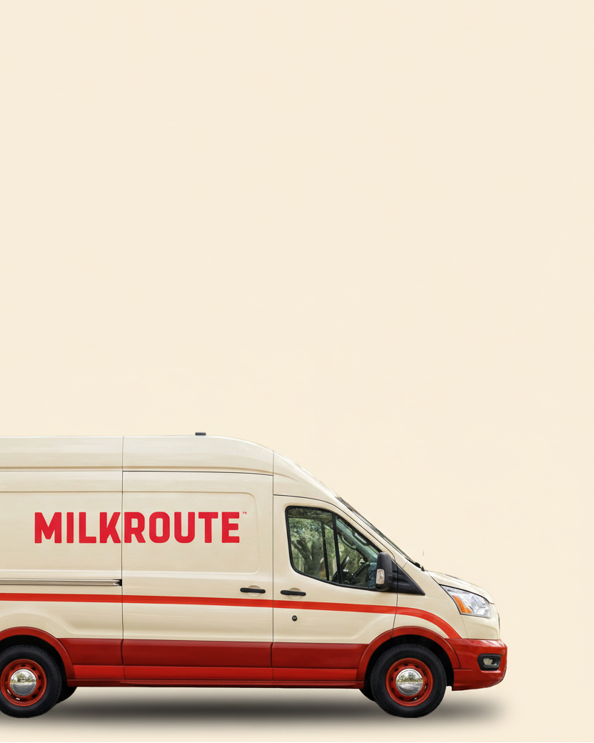 Side view of a milk route delivery van with 'MILKROUTE' text on a beige background